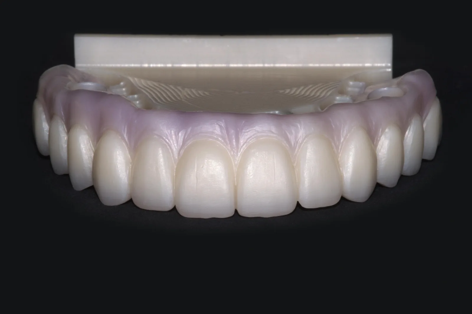 Raw stained zirconia full-arch framework before finishing